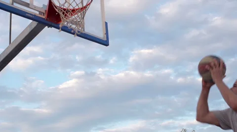 Slow-Mo: Basketball Player Scores A Basket By A Slam Dunk Stock Footage