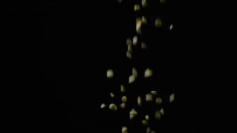 Slow mo beans of lentils fall on a black background Stock Footage 73073990