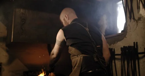 Slow Mo Blacksmith Forging Piece Of Metal With Hammer Stock Footage 112850810