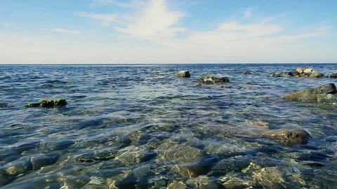 Slow mo blue sky and clear blue sea Stock Footage 80486016