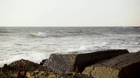 Slow mo broken about concrete reinforcement sea wave Video stock 82385679