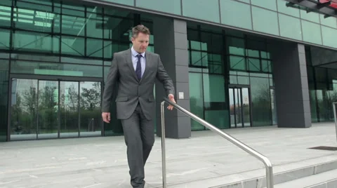 Slow-Mo: Businessman Slides Down The Rail And Fixes His Tie. Stock Footage 35252514