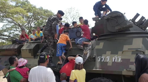 Slow-Mo Children Coming Sit Inside and Climbing on Top the Armored Vehicle Stock Footage 66492900
