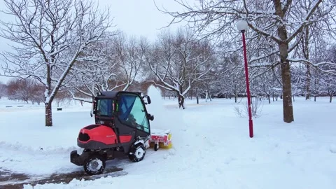 Slow mo cleaning snow with a tractor Stock Footage 225136274