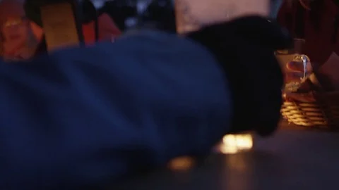 Slow mo Close Up of Apres Ski on a patio with Pitcher of Beer and Hot Drink Stock Footage 83359795