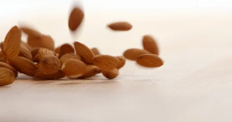 Slow Mo Close Up Falling Almonds Stock Footage 112863375