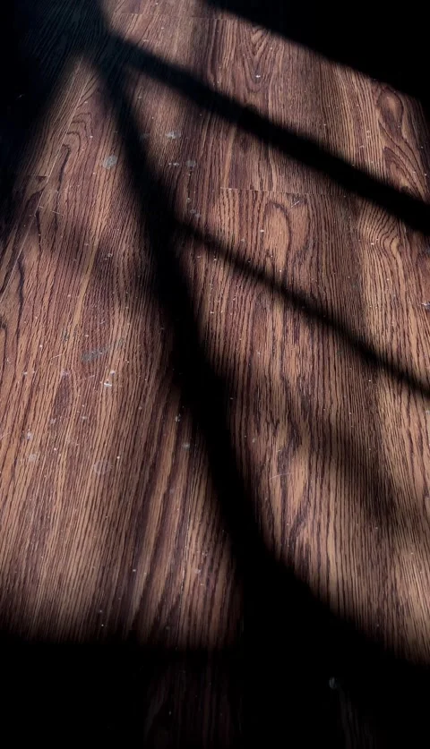 Slow mo close up hand scratching itchy bare foot on wooden floor. Stock Footage 342516177