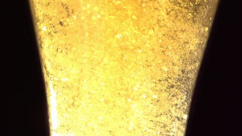 Slow Mo Close Up Illuminated Bubbles In Beer Glass Stock Footage 113201890