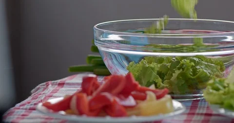 Slow-Mo Close Up Lettuce Falling Into Bowl Stock Footage 126089506