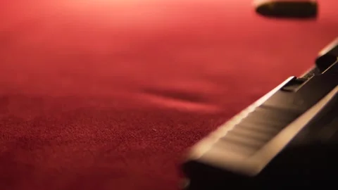 Slow Mo close up shot of Bullet dropping besides gun Video stock 230610260