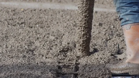 Slow Mo. Closeup. Pouring concrete mix on concreting formwork Stock Footage