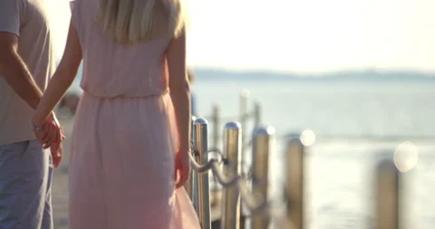 Slow Mo Of Couple Holding Their Hands And Looking At Sunset Stock Footage 144208398
