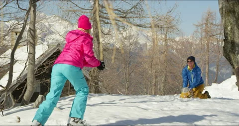 Slow Mo Of Couple Throwing Snowballs Stock Footage 140119731