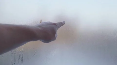 Slow mo drawing a funny face on misted glass Video stock 146649749