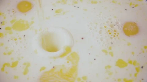 Slow mo. In egg whites egg mixture falls egg Stock Footage 75535488