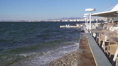 Slow mo empty cafe on the seashore in greece Stock Footage 84737264