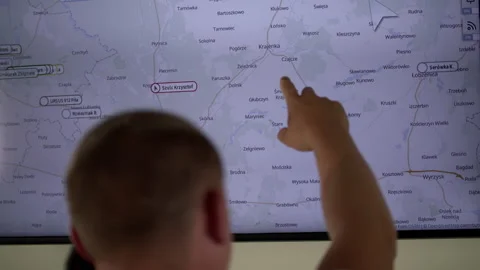 Slow-mo: Engineer Points Place on a Map with His Finger Stock Footage 138803184