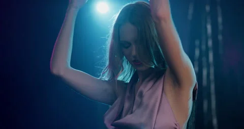 Slow Mo Of Fit Model Dancing In Dark Room Stock Footage 138365177