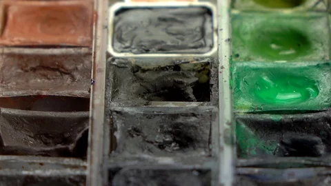 Slow-mo footage. Close up set of colorful watercolors. Dolly shot Stockbeeldmateriaal 87143699