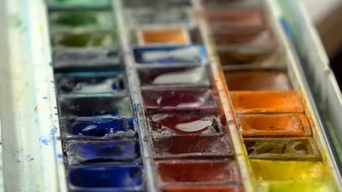 Slow-mo footage. Close up set palete of colorful watercolors and dipping brush Stock Footage 87143912