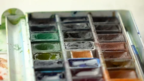 Slow-mo footage. Close up set palete of colorful watercolors and dipping brush 스톡 동영상 87143915