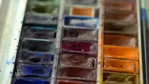 Slow-mo footage. Close up set palete of colorful watercolors and dipping brush Stock Footage 87143934