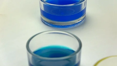 Slow-mo footage. Close-up shot of watercolors blended in a glass of water Stock-Footage 87143769
