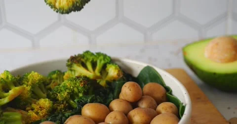 Slow-mo of fork piercing baby potato with camera slowly moving to right Stock Footage 282764861