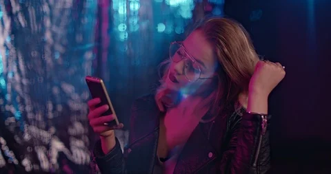 Slow Mo Girl Scrolling Through Phone In Club Stock Footage 120784794