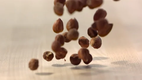 Slow Mo Gracefully Falling Hazelnuts Stock Footage 108149563