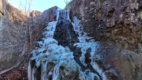 Slow-mo half frozen waterfall 動画素材 294706872