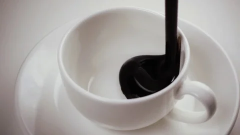Slow mo. Hot chocolate is poured into a mug Stock Footage 75187032