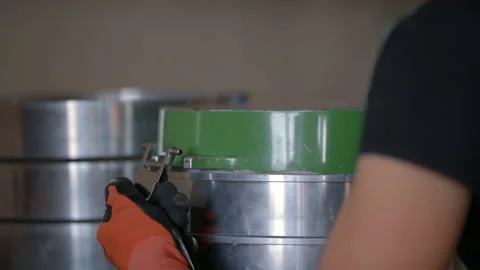 Slow-mo: Laboratory Technician Close Silver Strainer Barrel With Belts Stock Footage 138803702