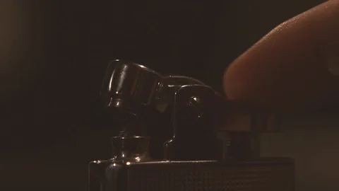 Slow Mo. Lighter sparking many times in male hand. Close up of lighting fire Видео 81500086