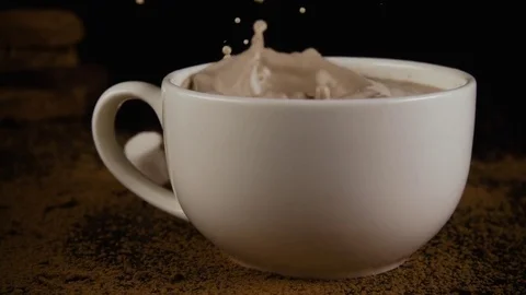 Slow mo. A lot of marshmallow falls into a cup of cocoa Stock Footage 75313042