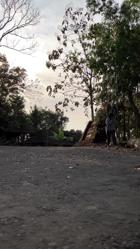 Slow mo low angle view of hijab woman jogging on rural asphalt street. Vídeo Stock 342369364