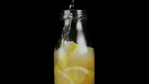 Slow mo. To make a lemonade in a bottle Stock Footage 76156156