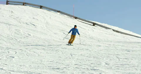 Slow Mo Of Man Going Down Snowy Hill Stock Footage 139763201
