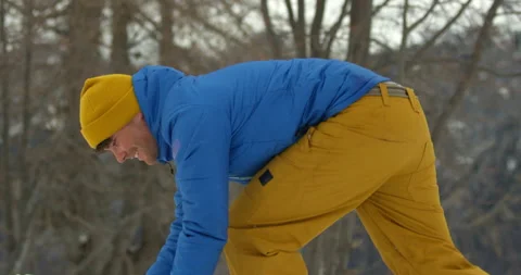 Slow Mo Of Man Making Snowball Stock Footage 139410349