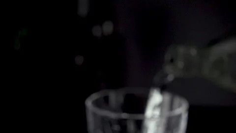 Slow mo movement of the camera on a glass with clear water Stock Footage 86690199