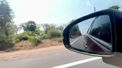 Slow-Mo of a moving car on both front and back view 스톡 동영상 253657860
