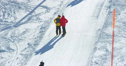 Slow Mo Of People Going Uphill During Skiing Stock Footage 139400563