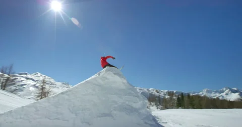 Slow Mo Of Person Jumping From Snow Slope Stock Footage 139398864