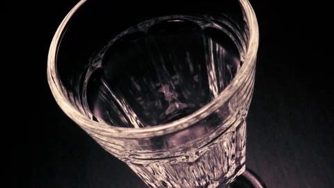 Slow mo pouring red wine in glass faceted Stock Footage 71822695