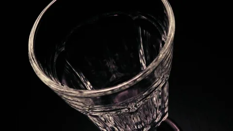 Slow mo pouring rose wine in glass faceted Stock Footage 71821714