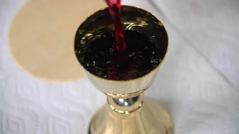 Slow Mo Pouring Wine Into Goblet Eucharist Cavanah Bread Stock Footage 307124040