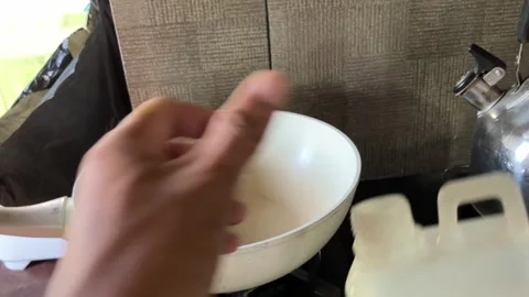 Slow Mo Pov Hands Pouring Cooking Oil Into Pan On Stove. Stock Footage 344523507