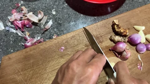 Slow Mo Pov Hands Slicing Garlic Clove On Wooden Cutting Board. Stock Footage 344524191