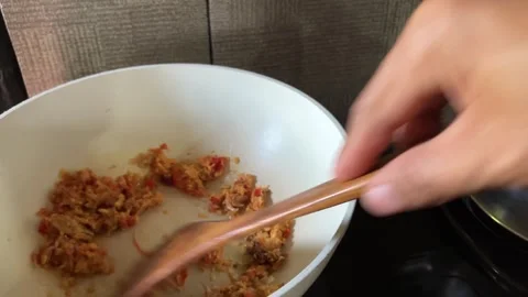 Slow Mo Pov Hands Stirring Spice Paste With Wooden Spatula In Pan. Stock Footage 344523605