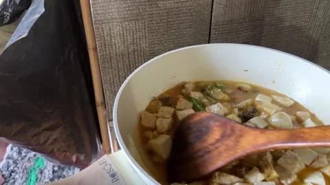 Slow Mo Pov Hands Stirring Tofu And Tempeh In Broth In Pan. Stock Footage 344524420